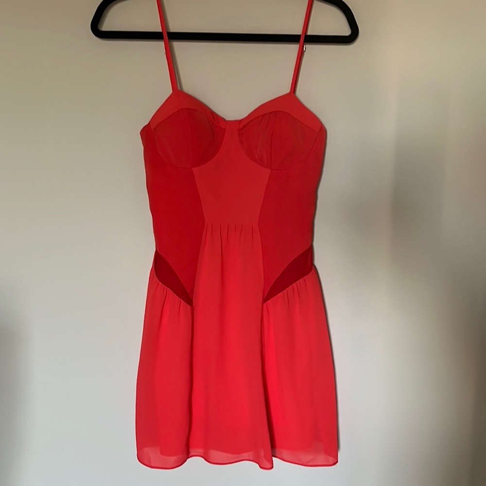 Orange mini dress with mesh details. Size 4